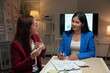 © crizzystudio - Female company employees and coworkers work together in the office Talking and giving advice Consult on management guidelines, calculations, recording data for meetings and summarizing income results.