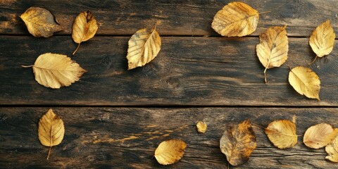 Poster - Autumn theme featuring golden leaves on a rustic wooden surface.