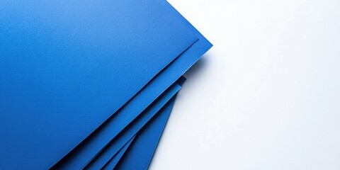 Canvas Print - Blue sheets of paper against a white isolated background.