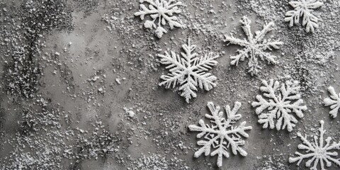 Wall Mural - Christmas or winter backdrop. Snowflakes on a gray concrete surface. Copyspace.