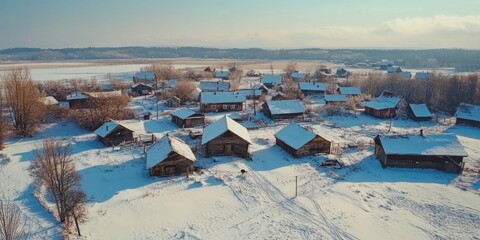 Poster - Winter drone footage of a village. Aerial view of the snowy landscape.
