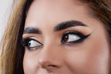 portrait of a beautiful woman with makeup isolated on gray background