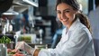 © Sasint - A food scientist smiling while analyzing food samples in a modern lab