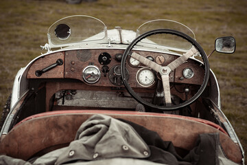 dashboard and steering wheel of an early vintage car 