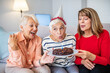 © Dragana Gordic - Senior Women Celebrating a Joyful Birthday at Home Together