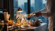 © fotofabrika - Elegant room service breakfast setup featuring a variety of dishes in a luxury hotel with a city view at dawn