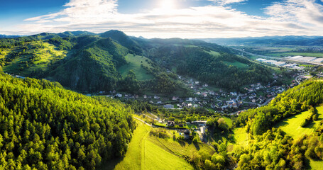 Green countryside landscape nature panorama with meadow, forest and village Hricovske Podhradie, Slovakia