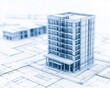 © Preeyanuch - Architectural model of a modern building on blueprint design, showcasing innovative construction and urban planning concepts.
