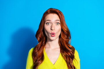 Canvas Print - Photo of crazy girl with ginger hairstyle dressed yellow knit cardigan astonished staring pouted lips isolated on blue color background