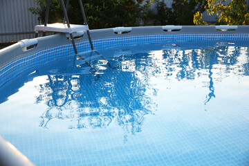 Canvas Print - Above ground swimming pool outdoors on sunny day, closeup