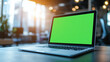© Duaa - 3d realistic render of laptop with green screen chroma key monitor in modern office cafe with warm lighting sunlight windows real atmosphere