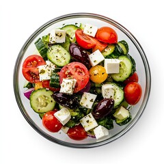 Wall Mural - Top view of a glass bowl with Greek salad isolated on white background