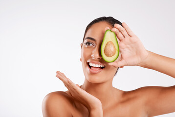 Skincare, avocado and woman in studio with health, beauty and collagen facial routine for glow. Natural, wellness and person with fruit for dermatology treatment with nutrition by white background.