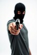 © NgoHong - Person in black balaclava pointing gun