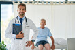 © SensSai/peopleimages.com - Happy man, portrait and doctor with senior patient for consultation, medical assistance or visit at hospital. Young, male person or healthcare professional with smile or clipboard for clinic checkup