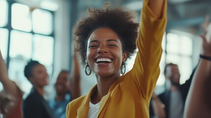 A dynamic shot of a minority business owner celebrating a successful project launch with their team