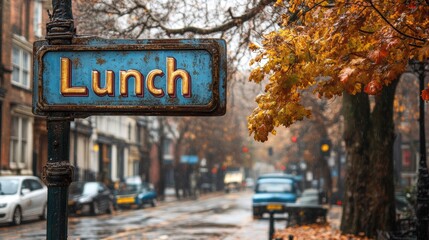 A nostalgic street scene in autumn featuring a vintage Lunch sign with golden leaves, classic cars, and quaint buildings on a rainy day