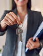 © anandart - Close up hand of home,apartment agent or realtor was holding the key to the new landlord,tenant or rental.After the banker has approved and signed the purchase agreement successfully.Property concept
