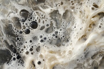 Fototapete - A natural, swirling mass of foam with muted tones and intricate patterns, creating an earthy and organic visual experience full of depth and complexity.