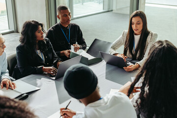 Teamwork among diverse business people in office meeting