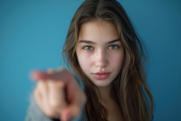 Poster - A young woman gesturing towards the viewer