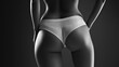 © Digital Storm - A slender athletic woman with a pronounced waist and a beautiful figure poses in black and white