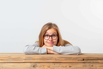 Sticker - A person sits at a wooden table, focused on their work