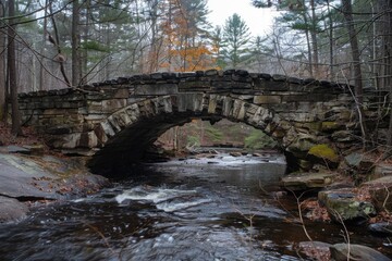 Sticker - A natural stone bridge spanning a tranquil forest stream