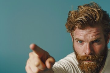 Poster - A person with a long beard looking directly at the viewer