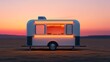 © Kulvarin - A futuristic food truck equipped with smart cooking tech, sunset background, wideangle shot