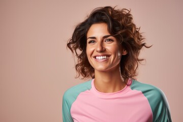 Wall Mural - Portrait of a grinning woman in her 30s sporting a breathable mesh jersey isolated in pastel or soft colors background