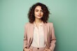 © Markus Schröder - Portrait of a content woman in her 20s dressed in a stylish blazer isolated on pastel or soft colors background