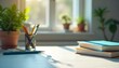© Robiul - A desk with office supplies and books, with a window in the background