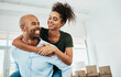 © SensSai/peopleimages.com - Piggyback, boxes and moving with couple in new home for real estate, investment and property purchase. Mortgage, opportunity and renting with people in living room for happy, future and relocation