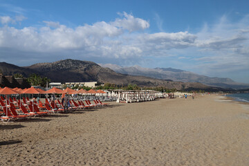 Hotel staff are preparing the beach for a new sunny day