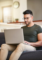 Leinwandbilder - Typing, couch and man with laptop, home and research for project, video editing and social media in lounge. Content creation, digital and busy in living room, creative and remote work in house