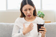 © Pormezz - Acid reflux disease, suffer asian young woman have symptom gastroesophageal, esophageal, stomach ache and heartburn pain hand on chest from digestion problem after eat food, Healthcare medical concept