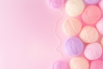 Surreal floating yarn balls in pastel shades against a dreamy gradient background