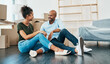 © SensSai/peopleimages.com - Future, boxes and moving with couple in new home for real estate, investment and property purchase. Mortgage, opportunity and renting with people in living room of apartment for relax and relocation