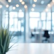 © Tadeusz - A vibrant indoor office space with blurred lights, showcasing greenery in focus.