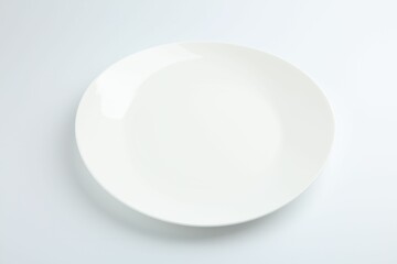 Sticker - One empty ceramic plate isolated on white