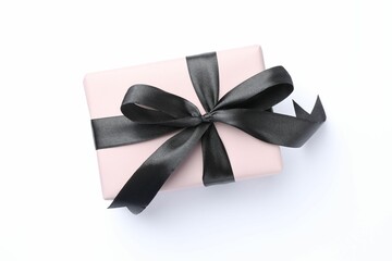 Wall Mural - Beautiful gift box with black bow isolated on white, top view