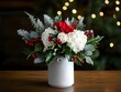© Janie - A white vase with red berries and white flowers