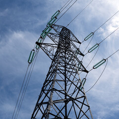 electric pylon blue sky in background