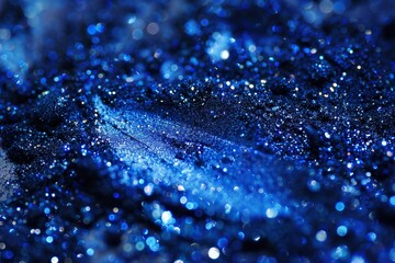 Poster - Vibrant blue glitter scattered across a surface, showcasing a blend of textures and sparkling light reflections reminiscent of a starry night.