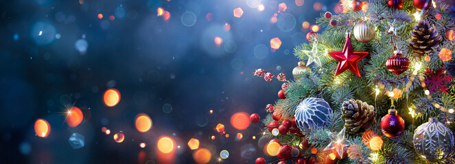 Wall Mural - christmas tree - ornaments hanging fir at blue eve night with abstract bokeh lights