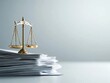 © Anutha - A golden scale of justice positioned on a pile of documents, illustrating the importance of fairness in corporate practices