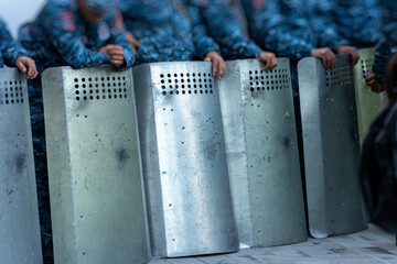 Sticker - Police with shields during a protest in the city, political unrest