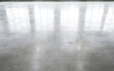 Poster - Reflective polished concrete floor in bright, spacious interior with abundant natural light during the day