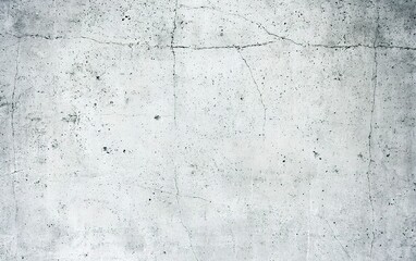 Poster - Concrete wall with cracks revealing an industrial texture in a well-lit urban environment